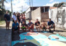 Moradores do bairro Colméia entram no clima da Copa e pintam ruas em Guaxupé